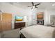 Bright main bedroom features a fireplace, TV, ceiling fan, and ensuite bathroom access at 536 S Vine St, Denver, CO 80209