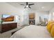 Bright main bedroom features a fireplace, TV, ceiling fan, and ensuite bathroom access at 536 S Vine St, Denver, CO 80209