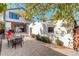 Outdoor patio featuring a seating area, landscaped garden, and a modern garage door at 536 S Vine St, Denver, CO 80209