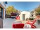 Rear patio space with red Adirondack chairs and an outdoor sofa at 536 S Vine St, Denver, CO 80209