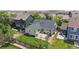 Aerial view of a home with a well-maintained lawn, patio, and fenced backyard situated in a residential community at 10181 E 112Th Way, Commerce City, CO 80640