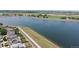 Scenic aerial view of a large lake surrounded by lush greenery, offering a tranquil escape at 10181 E 112Th Way, Commerce City, CO 80640