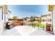 Backyard featuring a concrete patio with a built-in grill and a grassy area, perfect for outdoor activities at 10181 E 112Th Way, Commerce City, CO 80640