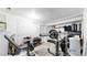A well-equipped basement gym featuring weightlifting equipment, offering a convenient space for fitness enthusiasts at 10181 E 112Th Way, Commerce City, CO 80640