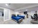 Finished bedroom with two twin beds, desk, tv, and sliding door, offering modern comfort and style at 10181 E 112Th Way, Commerce City, CO 80640