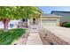Inviting single-Gathering home showcasing a well-manicured lawn and charming facade at 10181 E 112Th Way, Commerce City, CO 80640