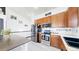 Modern kitchen featuring stainless steel appliances, light countertops, and ample cabinet space at 10181 E 112Th Way, Commerce City, CO 80640