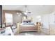 Bright primary bedroom with ceiling fan, lots of light, and attached bath at 10181 E 112Th Way, Commerce City, CO 80640