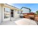 Back patio featuring a built-in grill, concrete paving, and a wooden privacy screen, great for entertaining at 10181 E 112Th Way, Commerce City, CO 80640
