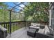 Relaxing back deck featuring comfortable seating, a pergola and mature trees at 11022 Trailrider Pass, Littleton, CO 80127
