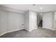 Finished basement features neutral paint, carpet, access to stairs and storage at 11022 Trailrider Pass, Littleton, CO 80127