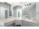 Well-lit modern bathroom with neutral countertops, and spacious vanity at 11022 Trailrider Pass, Littleton, CO 80127