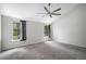 Spacious bedroom features neutral carpet, vaulted ceilings, large windows, and a ceiling fan at 11022 Trailrider Pass, Littleton, CO 80127