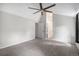 Vaulted ceilings and neutral carpet in the expansive bedroom at 11022 Trailrider Pass, Littleton, CO 80127