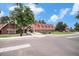 Community center with a red roof and a welcoming entrance, set in landscaped grounds at 11022 Trailrider Pass, Littleton, CO 80127