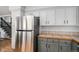 Modern kitchen featuring stainless steel appliances, granite countertops, and ample storage at 11022 Trailrider Pass, Littleton, CO 80127