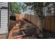 Landscaped side yard features wood steps to upper level at 11022 Trailrider Pass, Littleton, CO 80127