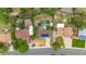 Aerial view of the property showing its backyard, solar panels, lawn and surrounding neighborhood at 1261 Eagle St, Aurora, CO 80011