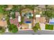 Aerial view of the property showing its backyard, solar panels, lawn and surrounding neighborhood at 1261 Eagle St, Aurora, CO 80011