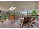 Back deck featuring wood flooring, wood railings, a wood table and six wood chairs at 1261 Eagle St, Aurora, CO 80011