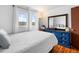 Bedroom featuring hardwood floors, bright windows and statement dresser at 1261 Eagle St, Aurora, CO 80011