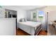 Well-lit bedroom with hardwood floors, closet and two windows offering natural light at 1261 Eagle St, Aurora, CO 80011