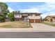 Charming two-story home with an attached two-car garage and solar panels on the roof at 1261 Eagle St, Aurora, CO 80011