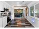Modern kitchen featuring open-concept access to dining area, white cabinetry and stainless steel appliances at 1261 Eagle St, Aurora, CO 80011