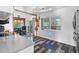 Modern kitchen featuring access to outdoor patio and open-concept access to dining area at 1261 Eagle St, Aurora, CO 80011