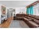 Bright living room featuring hardwood floors, stylish decor, and a welcoming atmosphere at 1261 Eagle St, Aurora, CO 80011