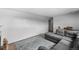 Cozy living room with a gray sectional sofa and a stylish blue patterned rug at 1261 Eagle St, Aurora, CO 80011
