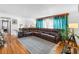 Spacious living room featuring hardwood floors and a large comfortable sofa at 1261 Eagle St, Aurora, CO 80011