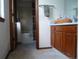 Hall bathroom with wood vanity, shower/tub combo and neutral wall color at 21734 Farmingdale Ct, Parker, CO 80138
