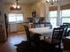 Bright kitchen and dining area with modern cabinets and a spacious dining table at 21734 Farmingdale Ct, Parker, CO 80138
