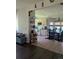 Bright kitchen featuring light wood cabinets, modern appliances, and an adjacent dining area with decorative chandelier at 21734 Farmingdale Ct, Parker, CO 80138