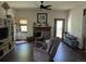 Cozy living room with a wood-burning fireplace, comfortable seating, and natural light from the nearby doorway at 21734 Farmingdale Ct, Parker, CO 80138