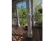 Cozy front porch featuring iron fencing, wooden floors and large supporting columns at 21734 Farmingdale Ct, Parker, CO 80138