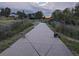 Neighborhood walking path with lush trees, green space, landscaping and community access at 21734 Farmingdale Ct, Parker, CO 80138