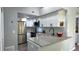 Well lit kitchen features stainless steel appliances, modern cabinetry, and updated countertops at 4760 S Wadsworth Blvd # 205, Littleton, CO 80123