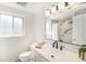Updated bathroom featuring stylish vanity, modern fixtures, and marble-look shower at 8191 Tennyson St, Westminster, CO 80031