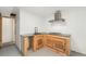 This kitchen includes wooden cabinets, a black faucet, and a gas stovetop with ventilation system at 8191 Tennyson St, Westminster, CO 80031