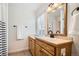 Updated bathroom with wood vanity, tile floor, and shower at 7505 Robinson Way, Arvada, CO 80003