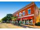 Pet supply store with red awning and street view at 7505 Robinson Way, Arvada, CO 80003