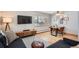 Dining area with wood floors and modern table at 7505 Robinson Way, Arvada, CO 80003