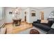 Dining area with wood floors and modern table at 7505 Robinson Way, Arvada, CO 80003