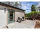 Cozy back patio featuring a pair of chairs, a side table and a view into the home at 6220 W 11Th Pl, Lakewood, CO 80214