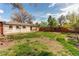 Exterior view of the house with patio and landscaped backyard at 6220 W 11Th Pl, Lakewood, CO 80214