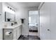 Contemporary bathroom with modern fixtures, a tiled walk-in shower, and direct access to the bedroom at 6220 W 11Th Pl, Lakewood, CO 80214