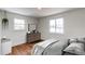 Bright bedroom with wood floors, natural light, and stylish furnishings at 6220 W 11Th Pl, Lakewood, CO 80214