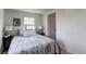 Comfortable bedroom features a large window and light colored walls and trim for a bright space at 6220 W 11Th Pl, Lakewood, CO 80214